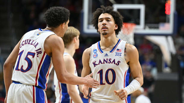 Mar 18, 2023; Des Moines, IA, USA; Kansas Jayhawks guard Kevin McCullar Jr. (15) and forward Jalen Wilson (10) react during the second half against the Arkansas Razorbacks at Wells Fargo Arena. Mandatory Credit: Jeffrey Becker-USA TODAY Sports